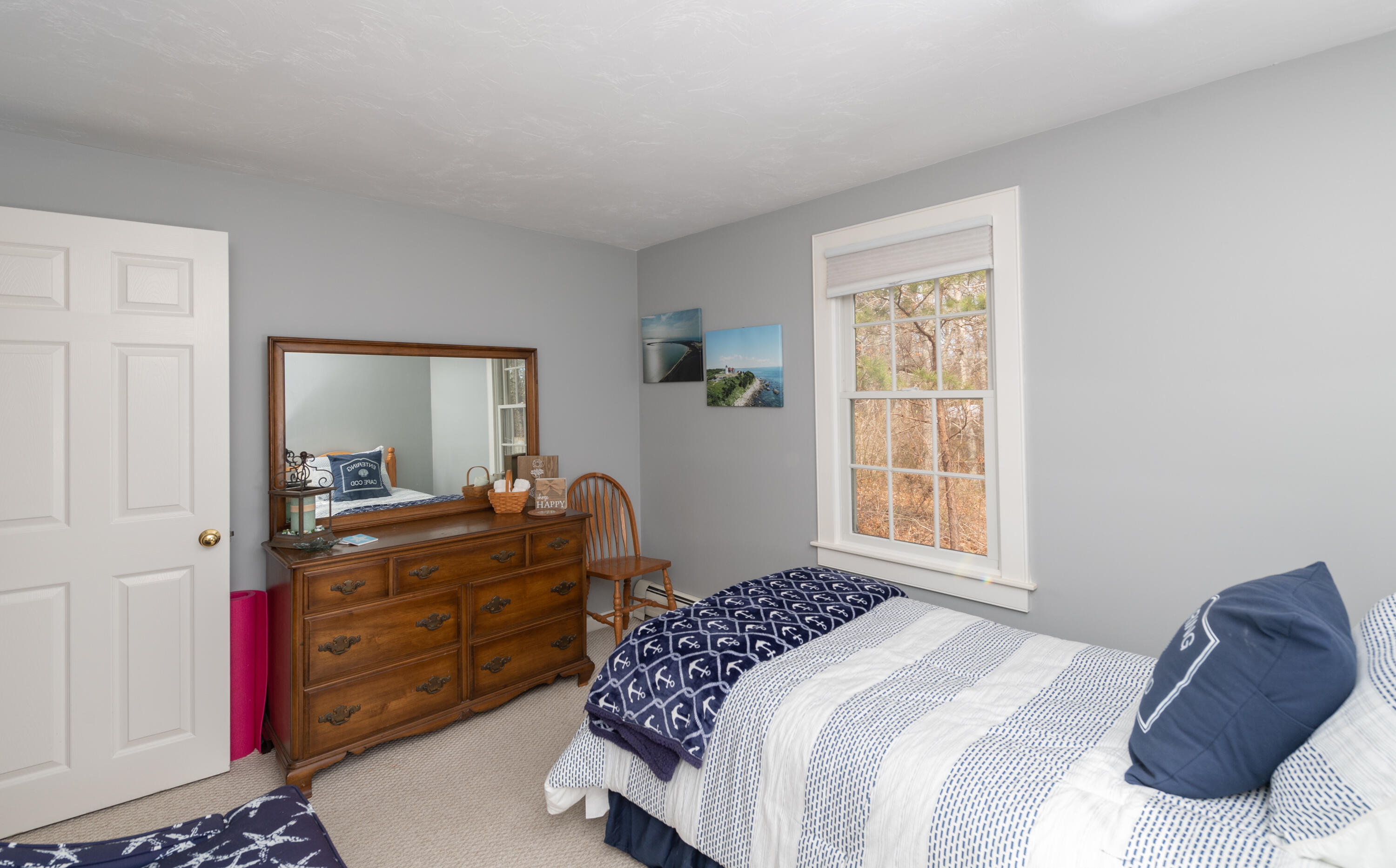 19 Carleton Drive Mashpee, MA 02649 - Photo 25 of 45 a bedroom with a bed and a dresser next to a window