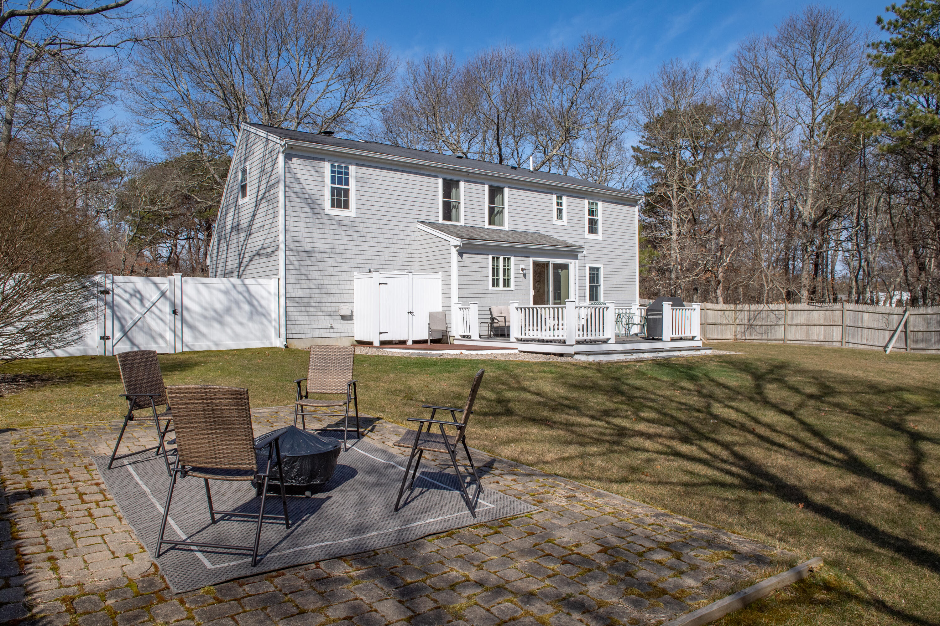 19 Carleton Drive Mashpee, MA 02649 - Photo 3 of 45 a view of a swimming pool with lounge chairs