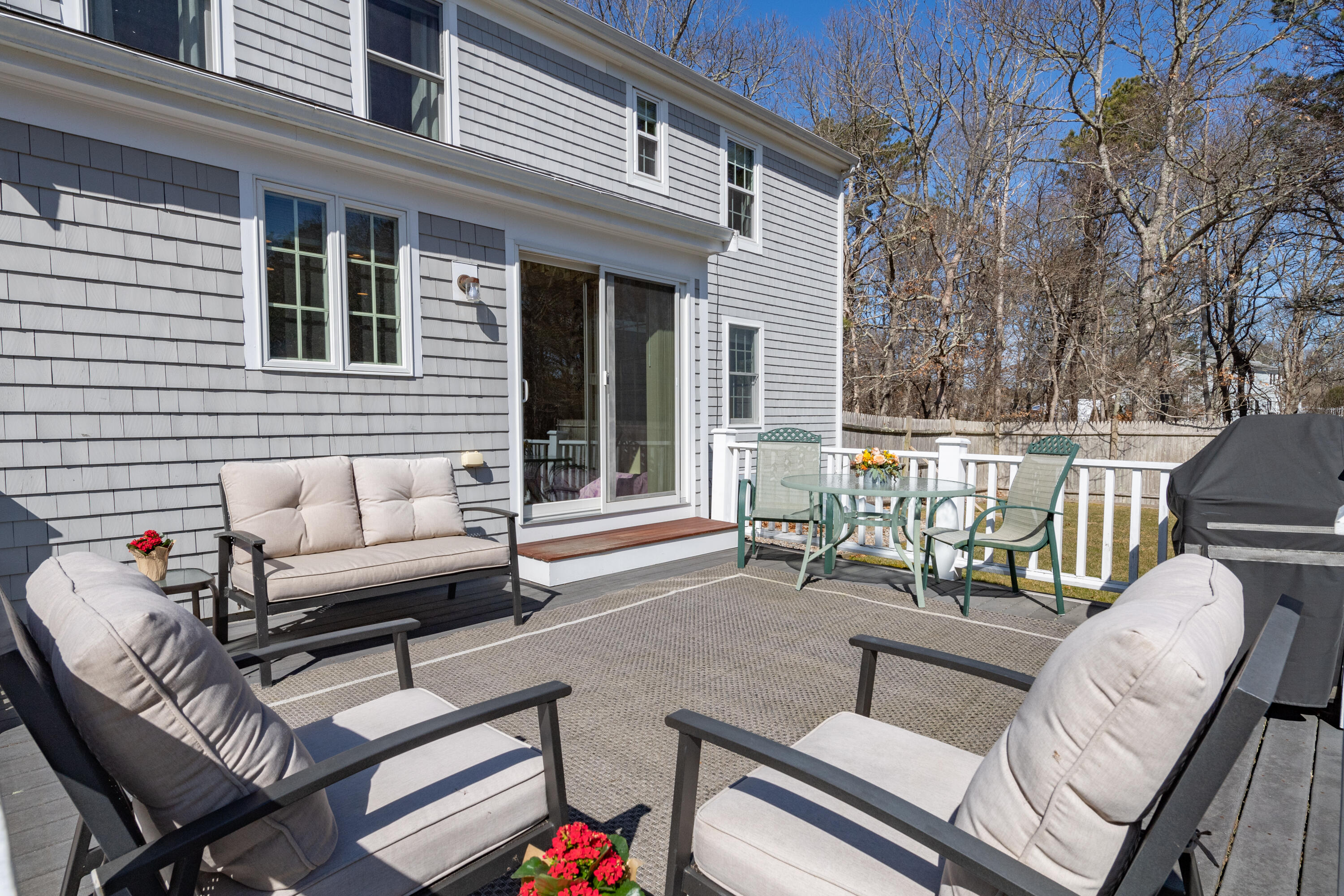 19 Carleton Drive Mashpee, MA 02649 - Photo 33 of 45 a view of a patio with couches chairs and wooden floor