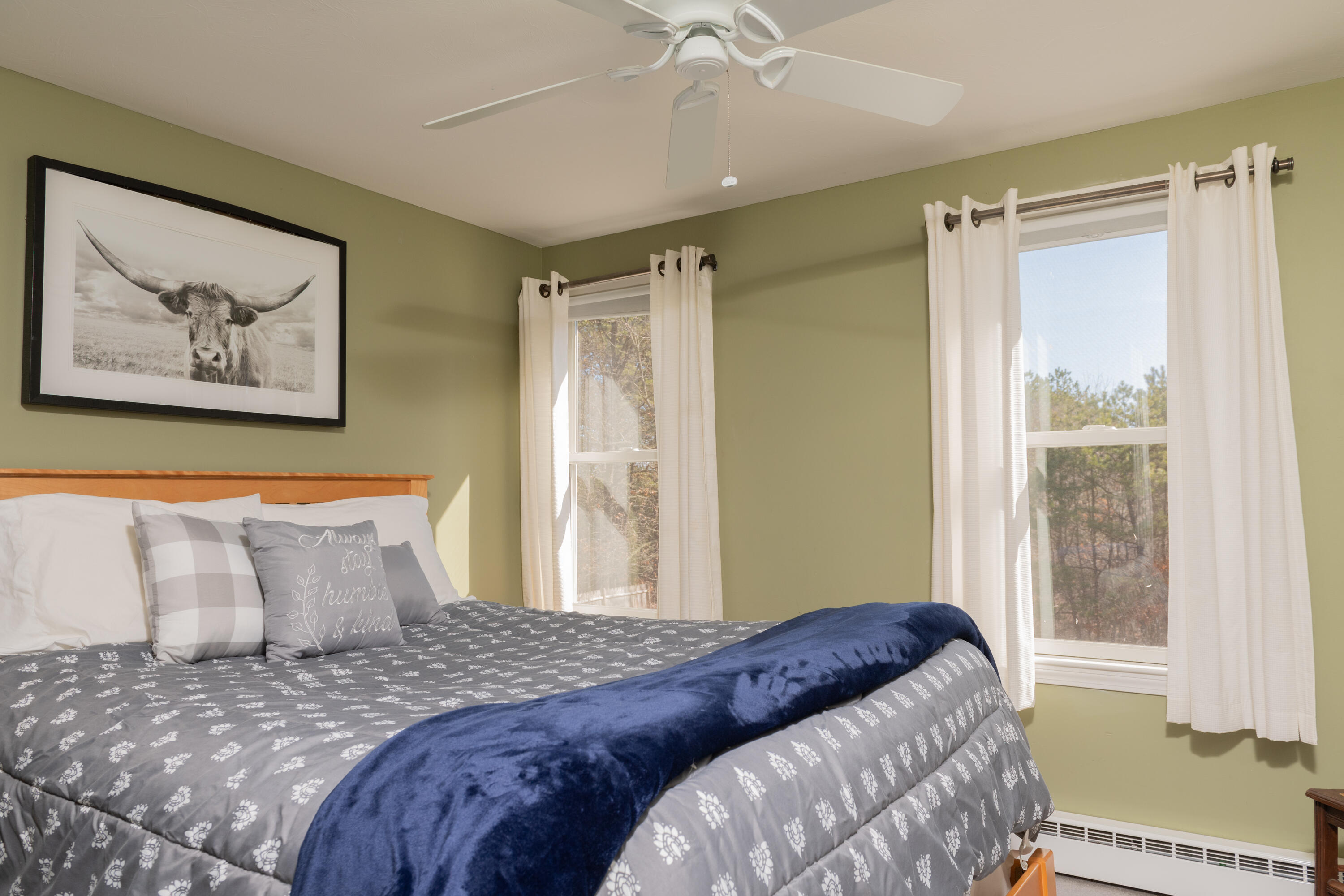 19 Carleton Drive Mashpee, MA 02649 - Photo 35 of 45 a bedroom with a bed and a painting on the wall