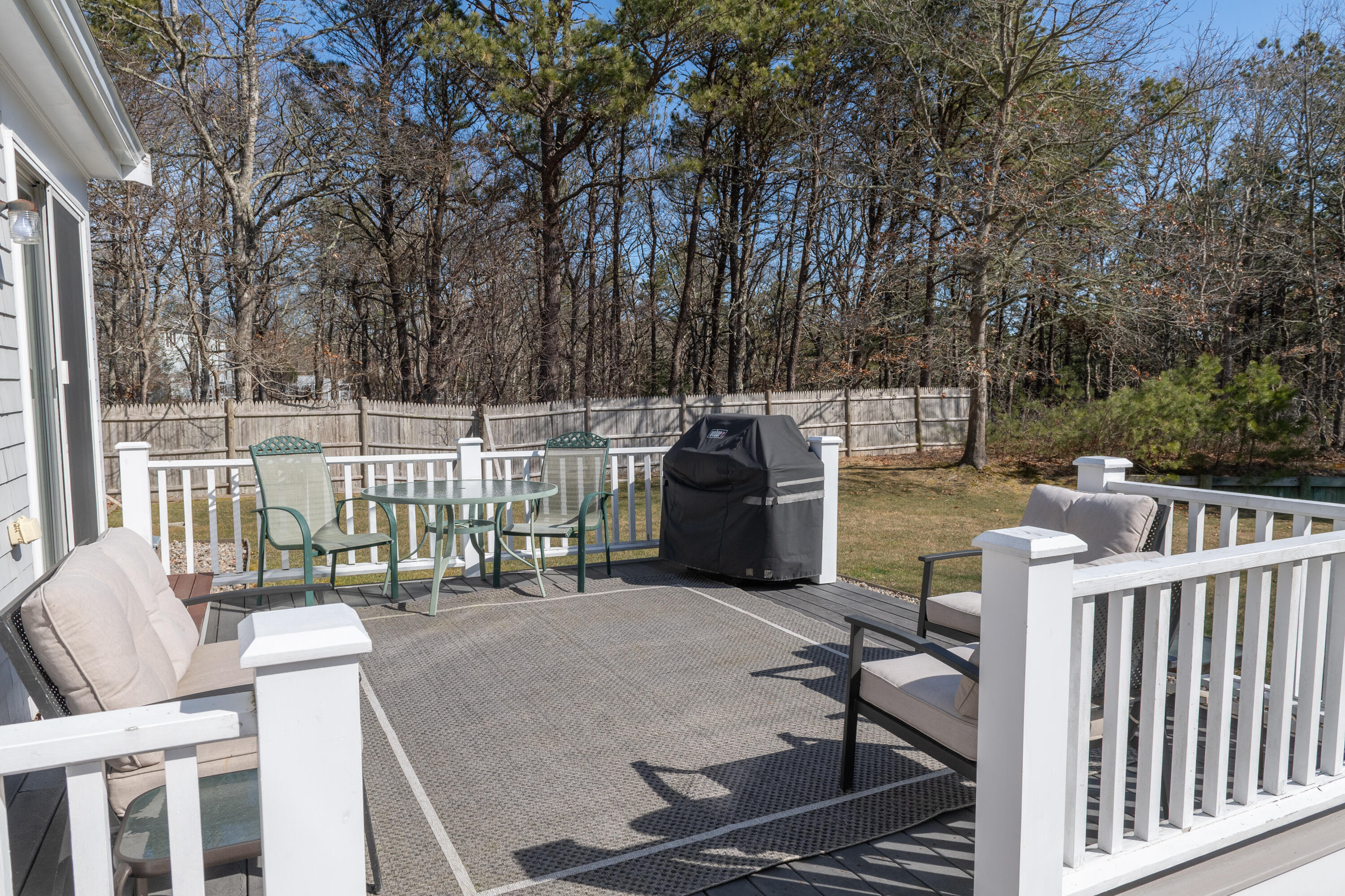 19 Carleton Drive Mashpee, MA 02649 - Photo 37 of 45 a view of a patio with a chairs and table in the patio