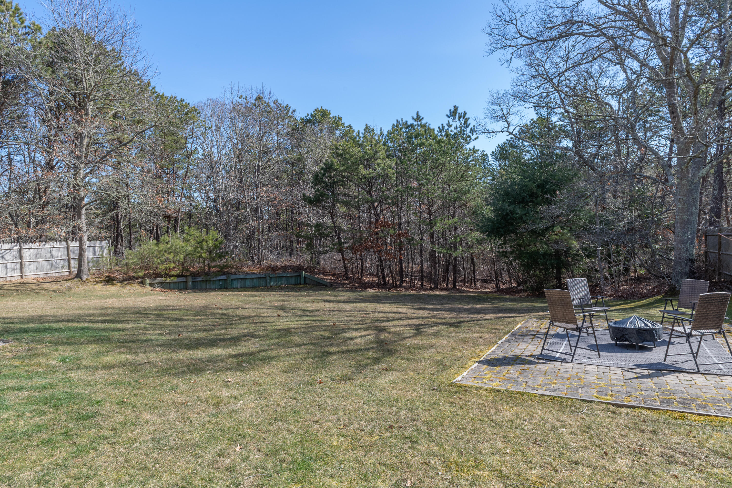 19 Carleton Drive Mashpee, MA 02649 - Photo 40 of 45 a view of a backyard with trees