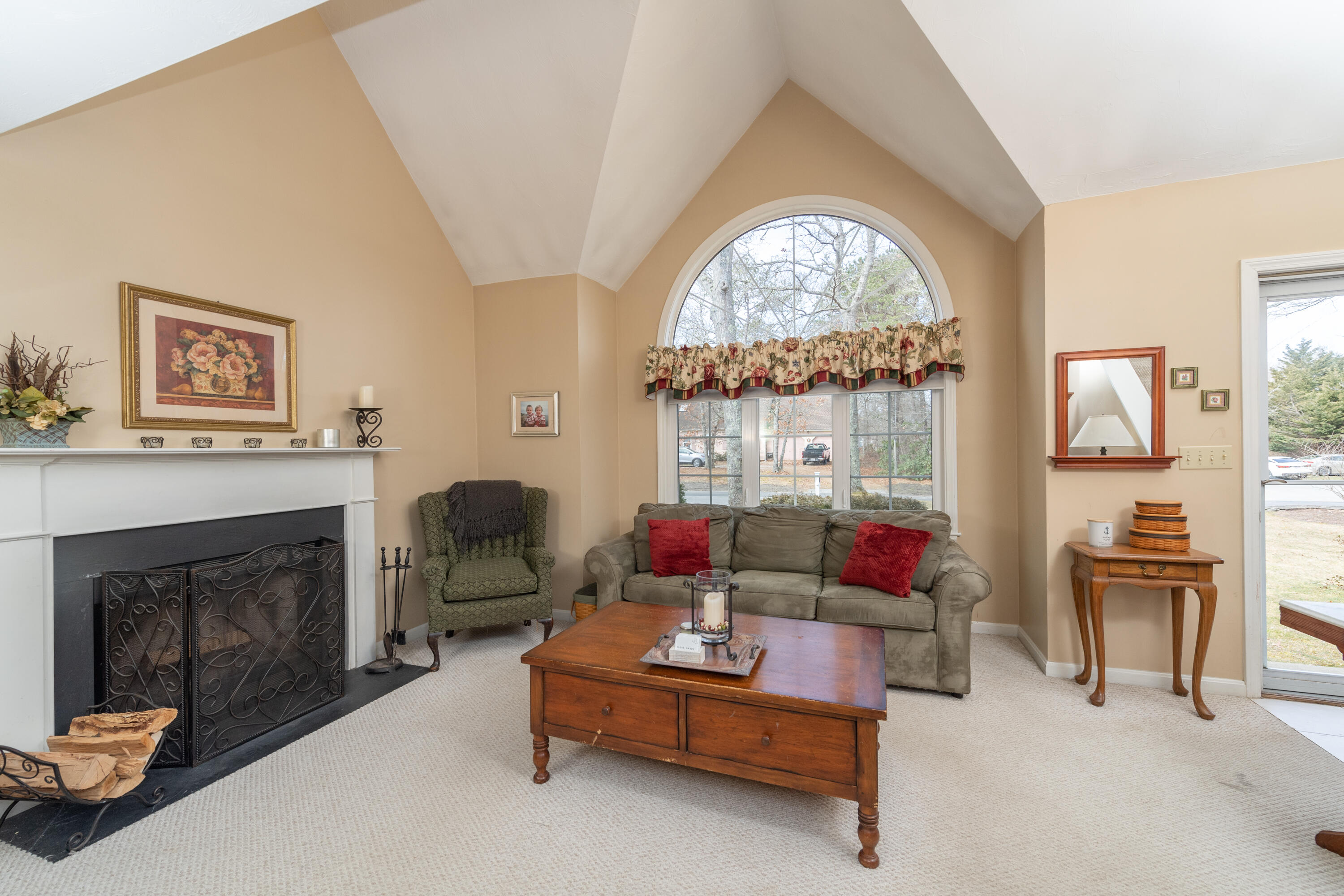 19 Carleton Drive Mashpee, MA 02649 - Photo 5 of 45 a living room with furniture and a fireplace
