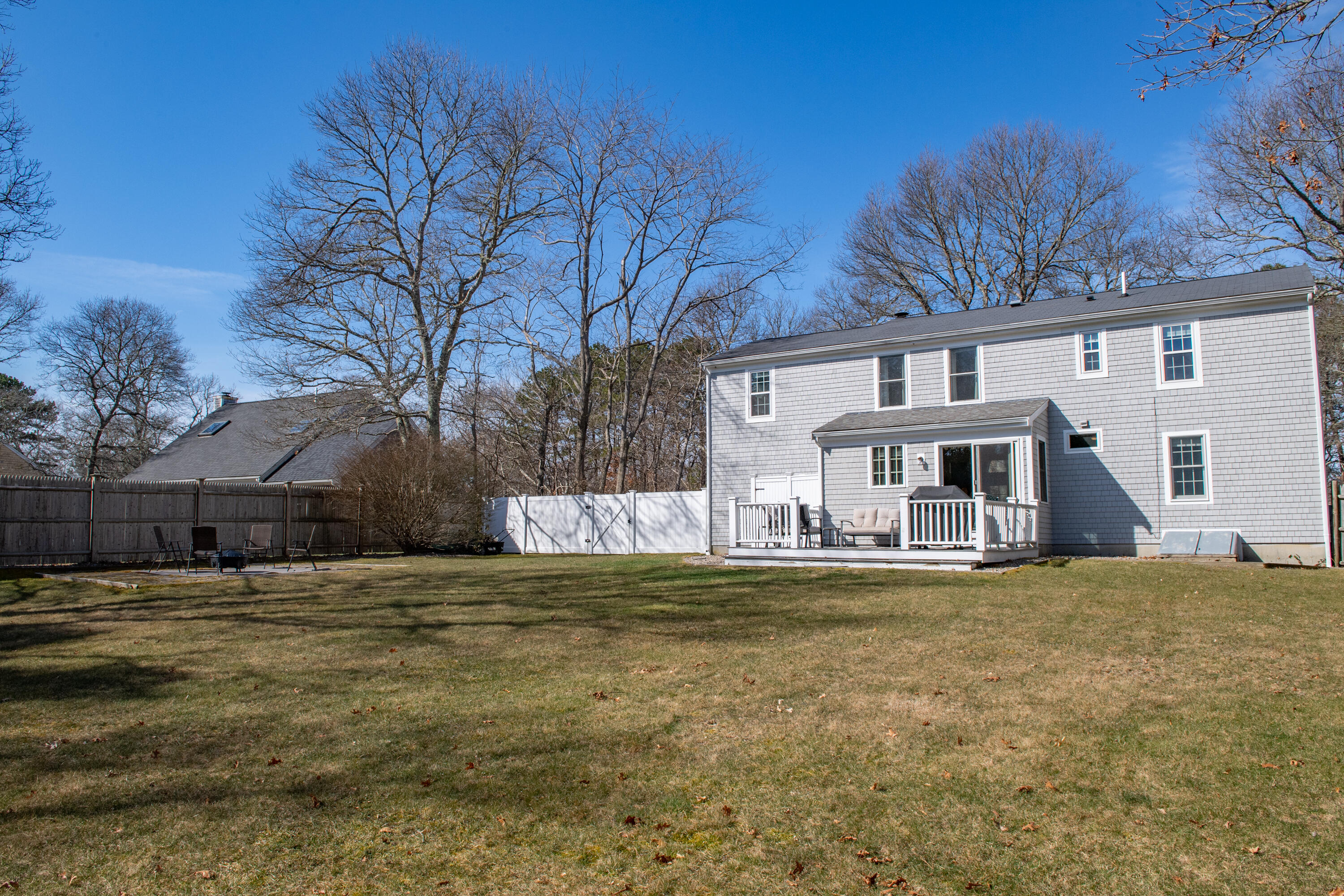 19 Carleton Drive Mashpee, MA 02649 - Photo 6 of 45 a view of a house with a swimming pool