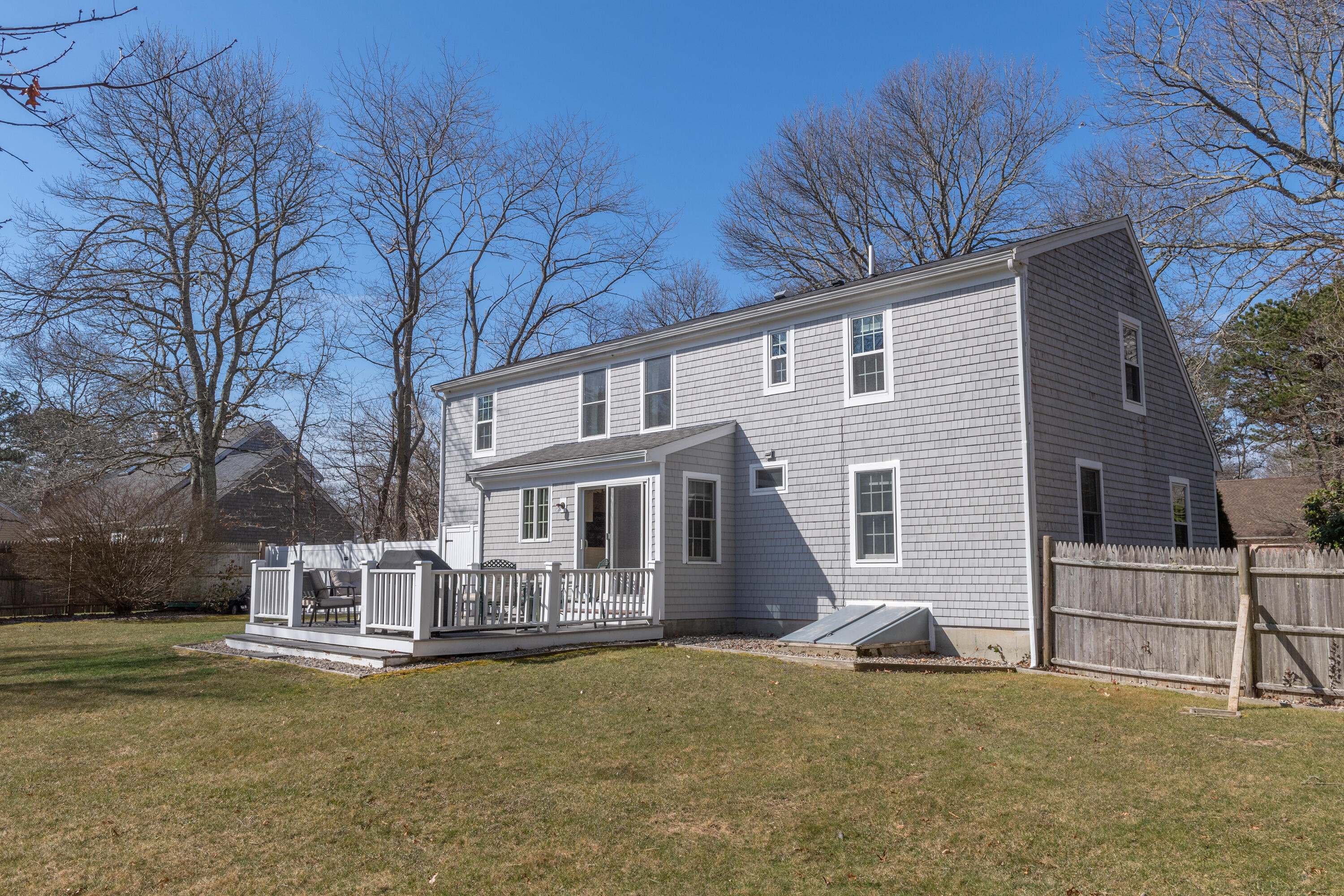 19 Carleton Drive Mashpee, MA 02649 - Photo 7 of 45 a view of a house with a snow in the yard