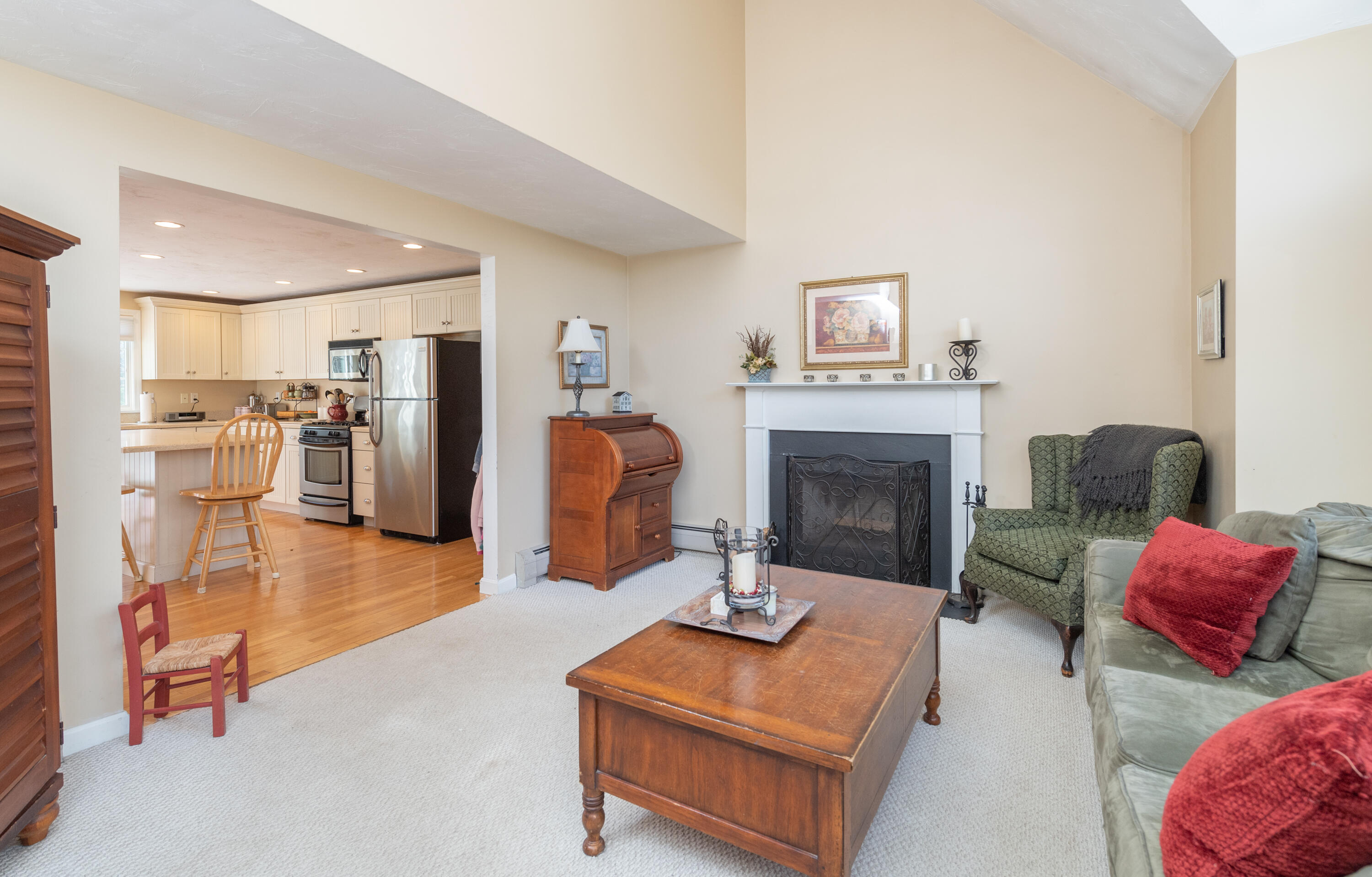19 Carleton Drive Mashpee, MA 02649 - Photo 8 of 45 a living room with furniture and a fireplace