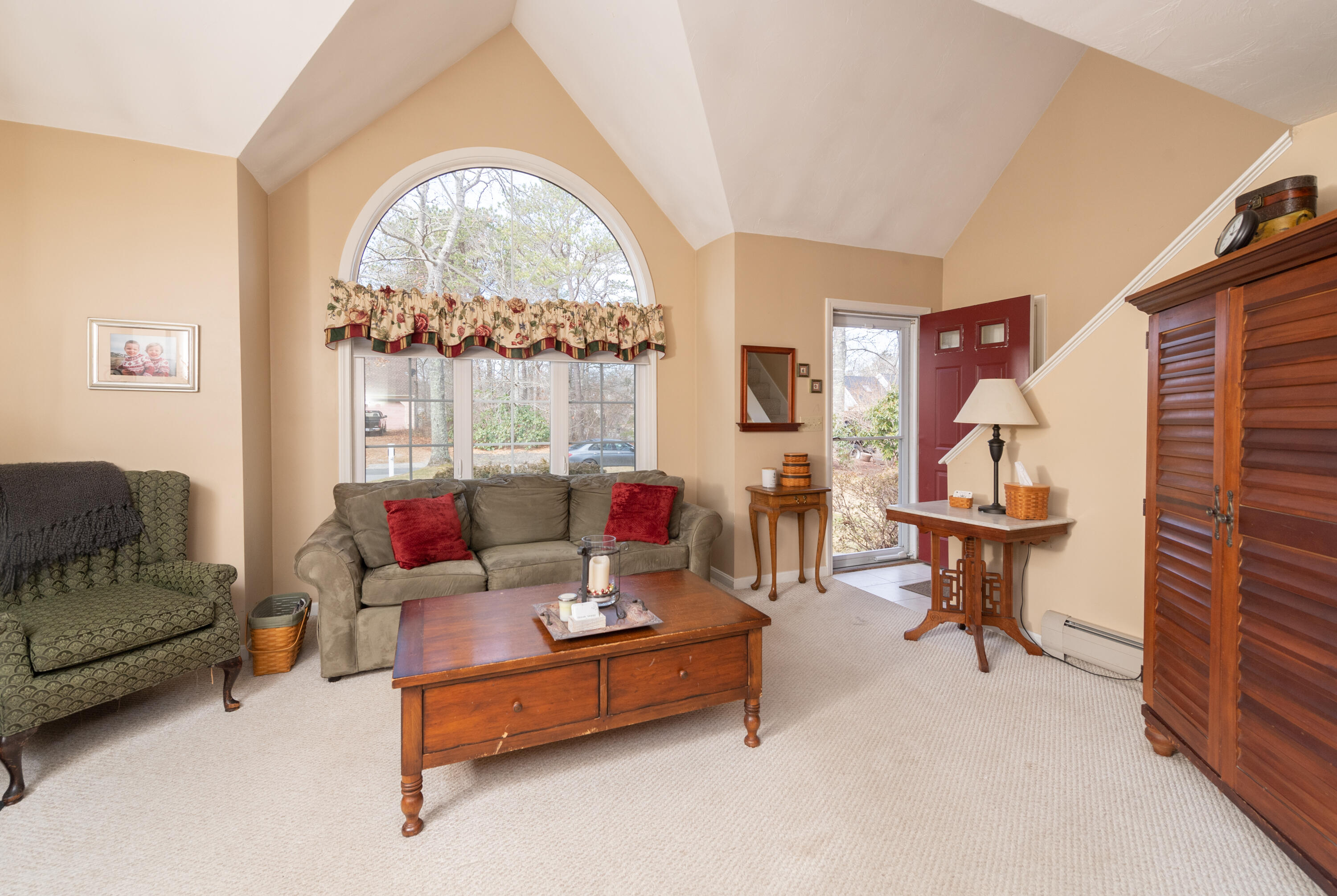 19 Carleton Drive Mashpee, MA 02649 - Photo 9 of 45 a living room with furniture and a large window