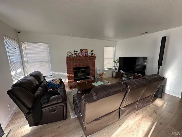 a spacious bedroom with a bed and window