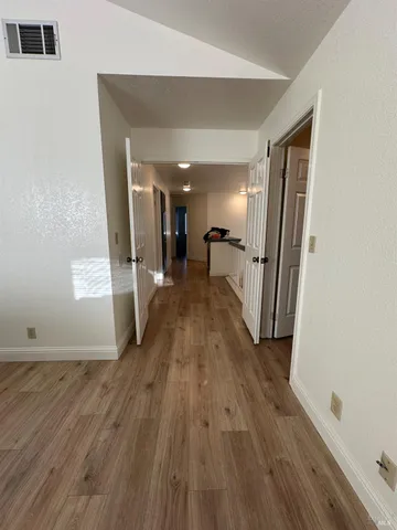 a view of a refrigerator in kitchen and a counter top space