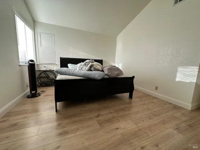 a front view of a house with lots of green space