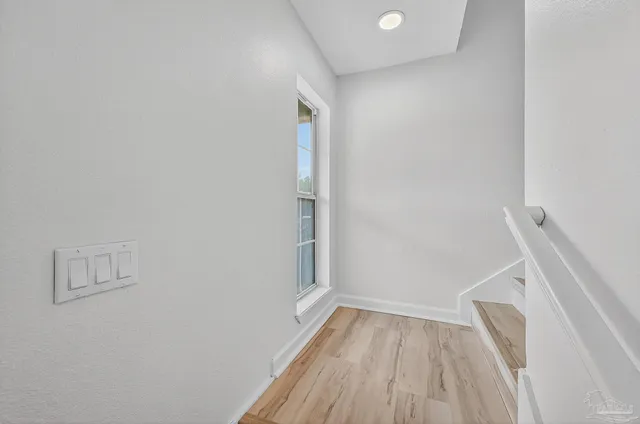 a view of room with wooden floor