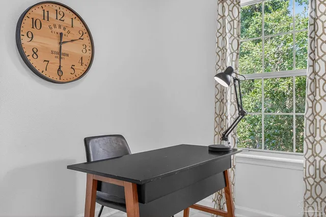 a view of a workspace with a large window