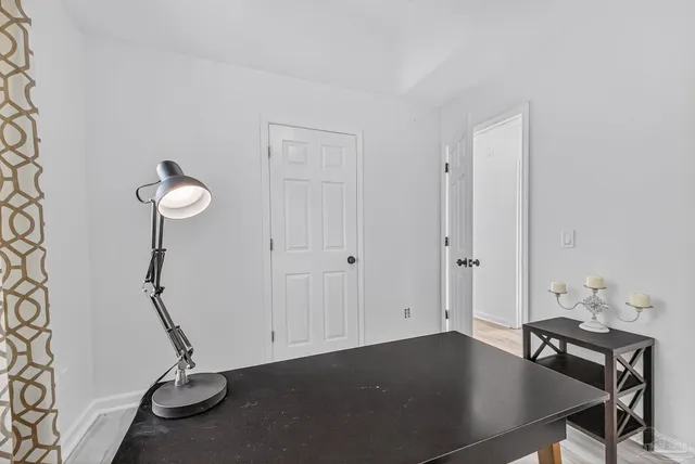 a view of a workspace with furniture