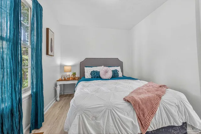 a bedroom with a bed and closet