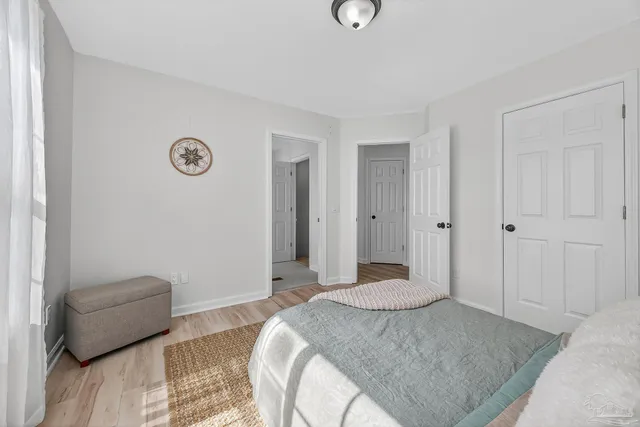 a bedroom with a bed and a couch