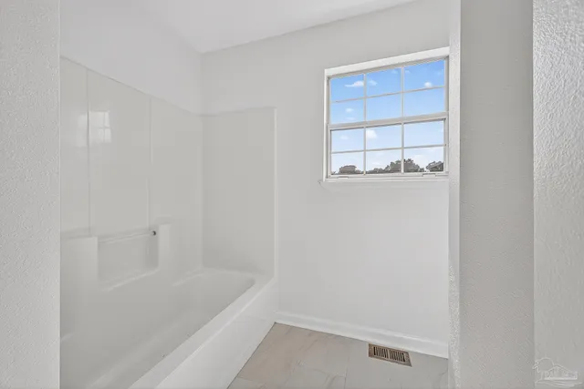 a bathroom with a bathtub