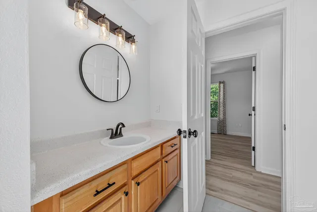 a bathroom with a sink and a mirror