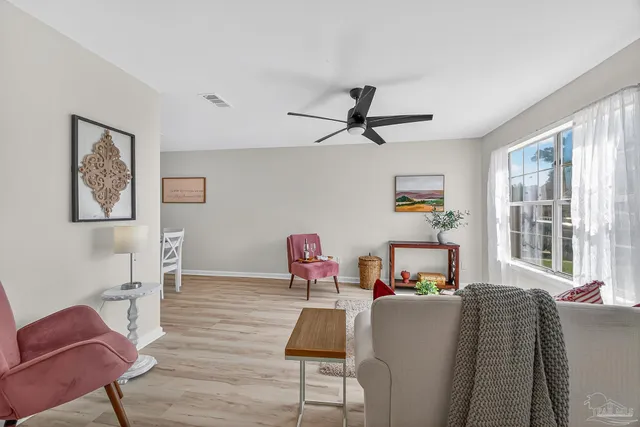a living room with furniture and a window