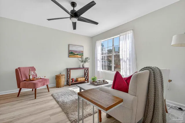a living room with furniture and a window
