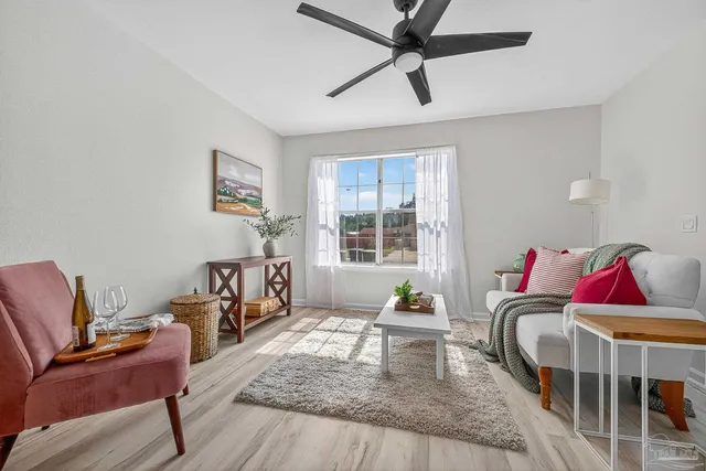 a living room with furniture and a window
