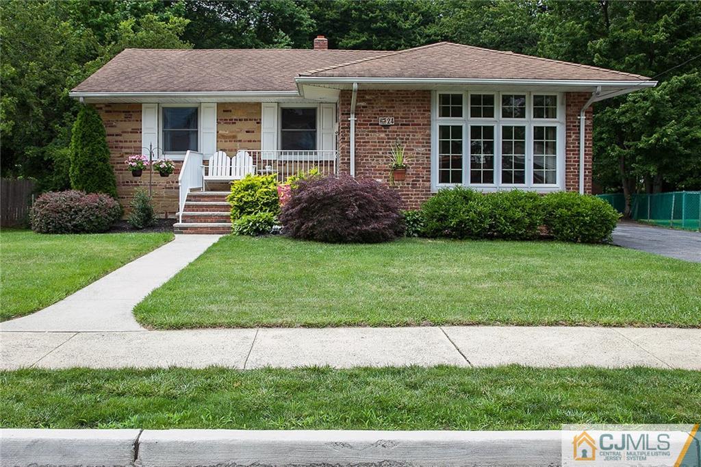 24 Gurley Road Edison, NJ 08817 - Photo 1 of 20 a view of a house with a yard and plants