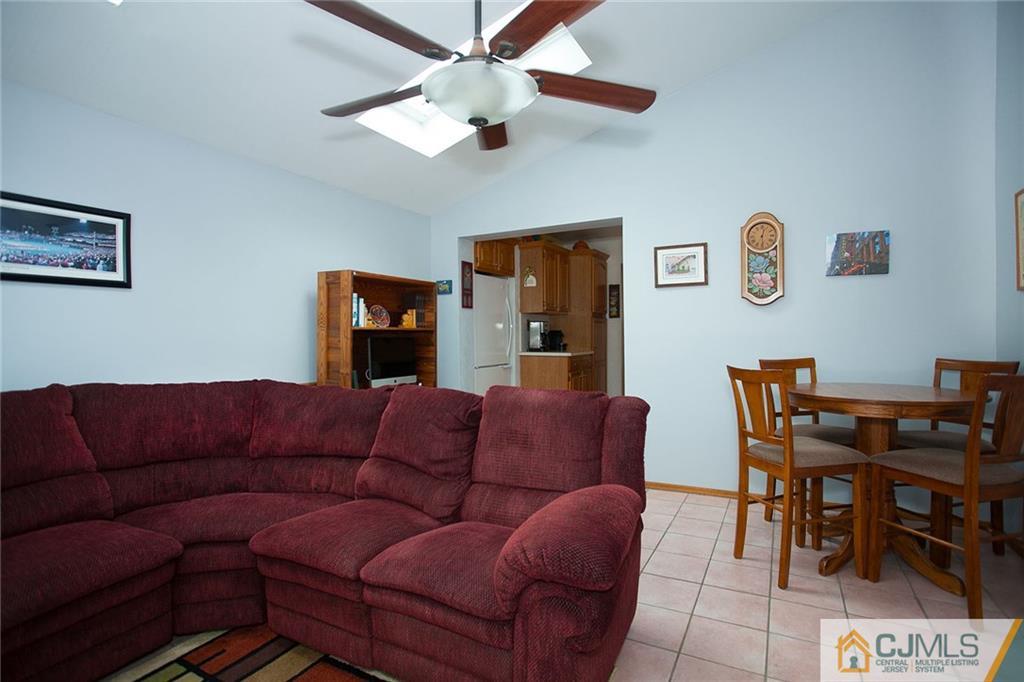 24 Gurley Road Edison, NJ 08817 - Photo 13 of 20 a living room with furniture a couch and a dining table