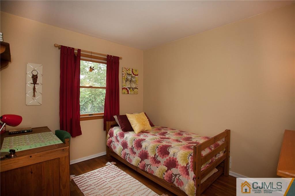 24 Gurley Road Edison, NJ 08817 - Photo 18 of 20 a bedroom with a bed and a window