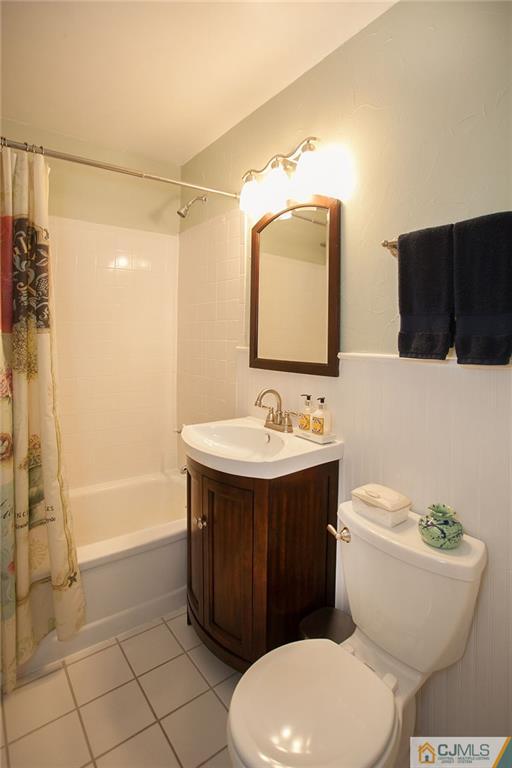 24 Gurley Road Edison, NJ 08817 - Photo 20 of 20 a bathroom with a sink toilet and shower