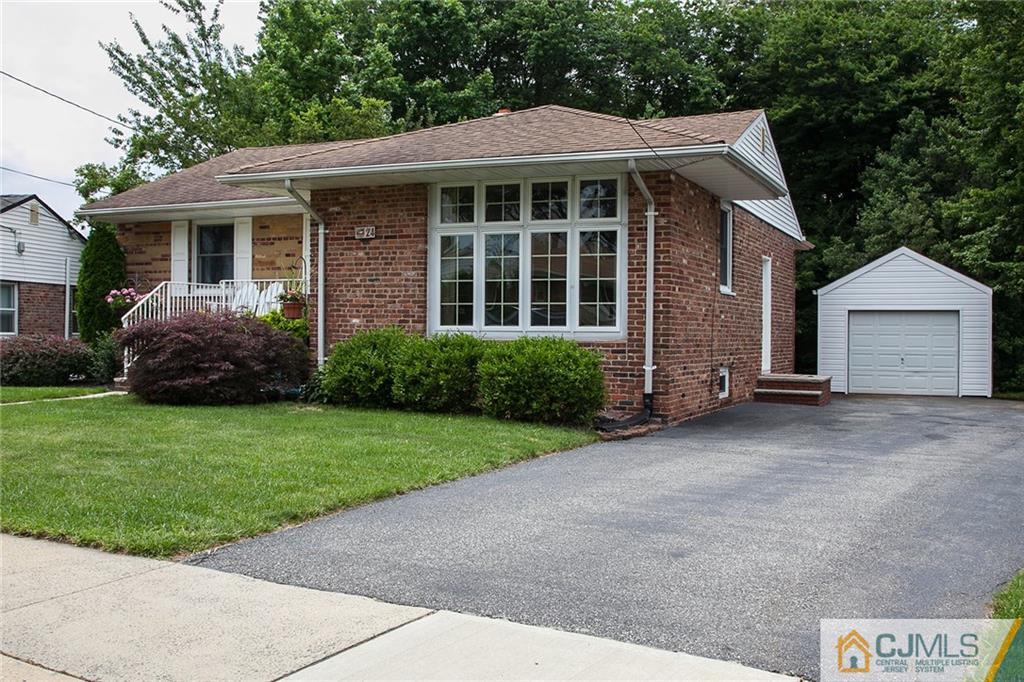 24 Gurley Road Edison, NJ 08817 - Photo 3 of 20 a front view of a house with a garden and yard