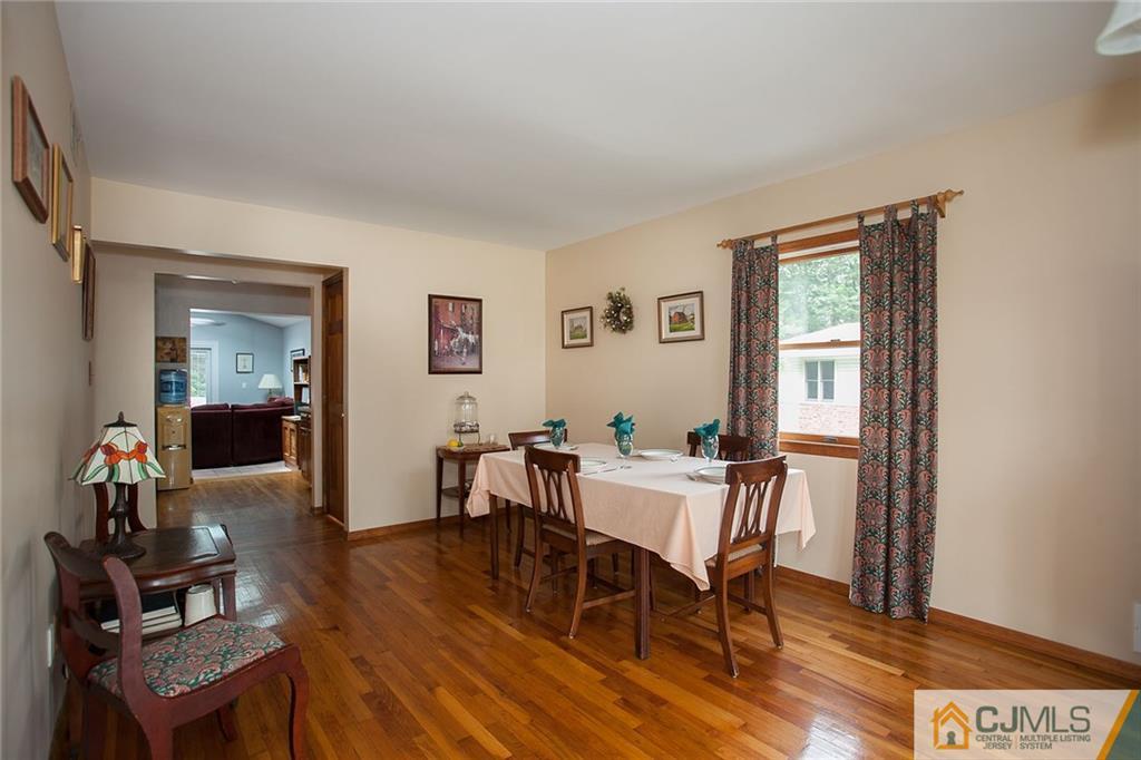 24 Gurley Road Edison, NJ 08817 - Photo 8 of 20 a view of a dining room with furniture window and wooden floor