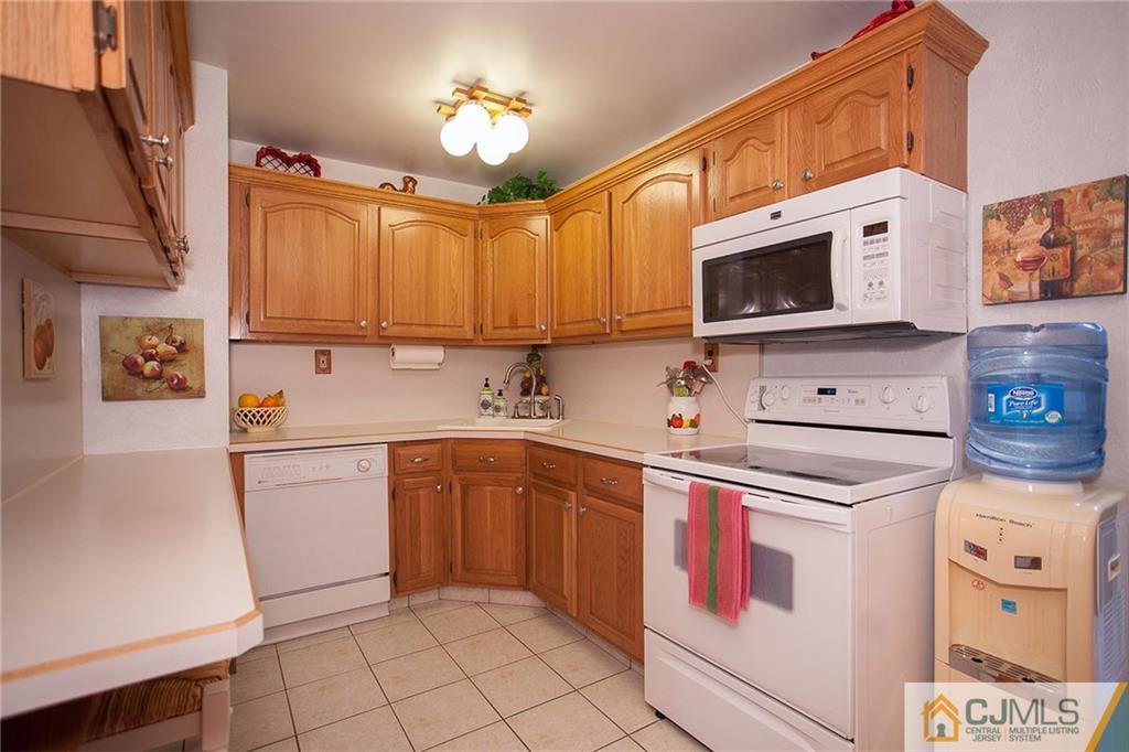 24 Gurley Road Edison, NJ 08817 - Photo 10 of 20 a kitchen with stainless steel appliances granite countertop a sink and a stove