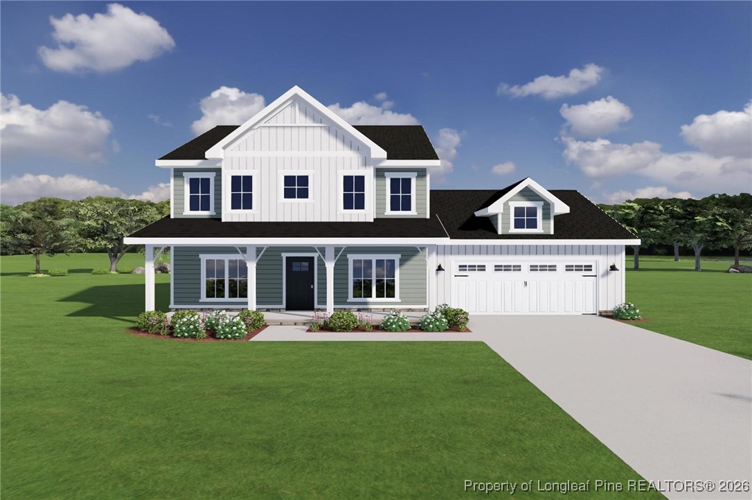 9864 Rockfish Road Raeford, NC 28376 - Photo 1 of 9 a front view of a house with a yard table and chairs