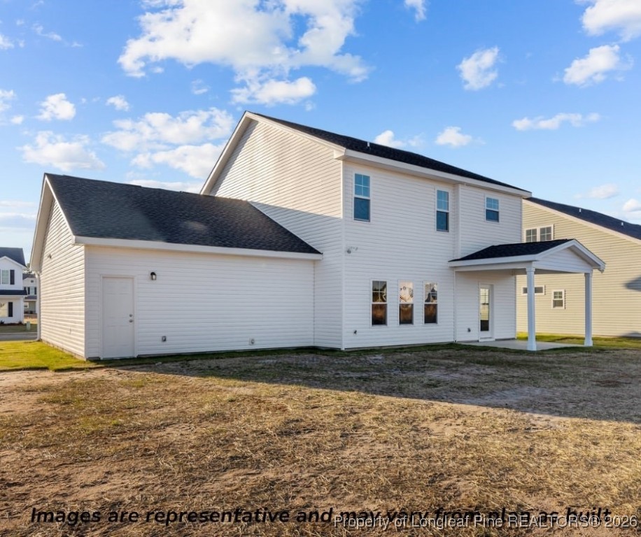 9864 Rockfish Road Raeford, NC 28376 - Photo 3 of 9 a view of a house with a yard