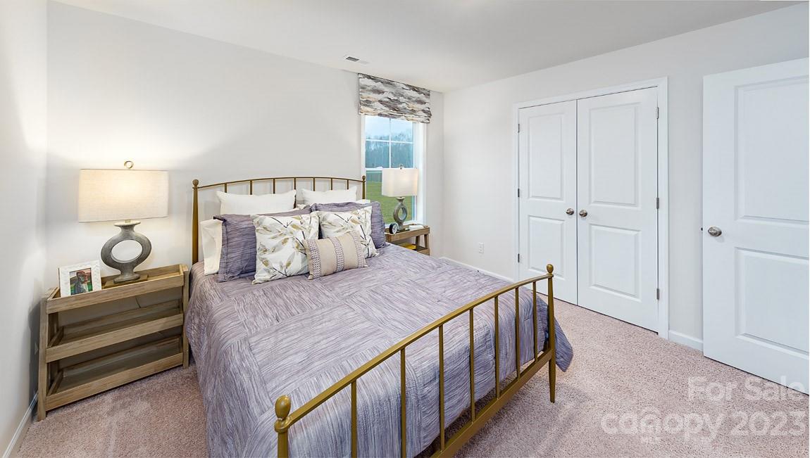 7903 Iron Road Sherrills Ford, NC 28673 - Photo 24 of 41 a bedroom with a bed and a window