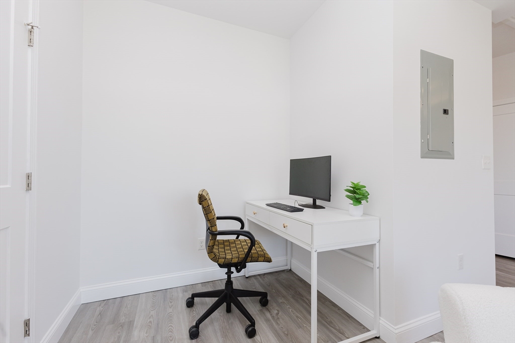 92-94 George Street, Unit 203 Boston, MA 02119 - Photo 14 of 35 a view of a workspace with furniture