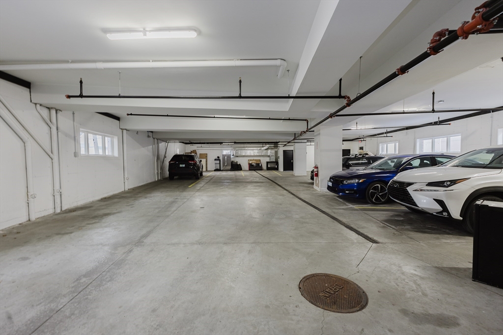 92-94 George Street, Unit 203 Boston, MA 02119 - Photo 35 of 35 a view of parking garage with cars