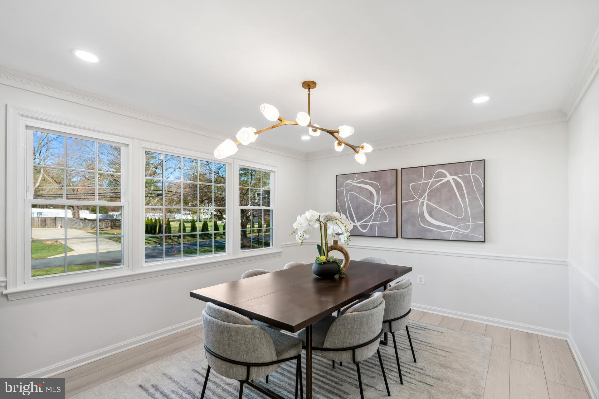 8417 Kingsgate Road Potomac, MD 20854 - Photo 12 of 61 a view of a dining room with furniture and wooden floor