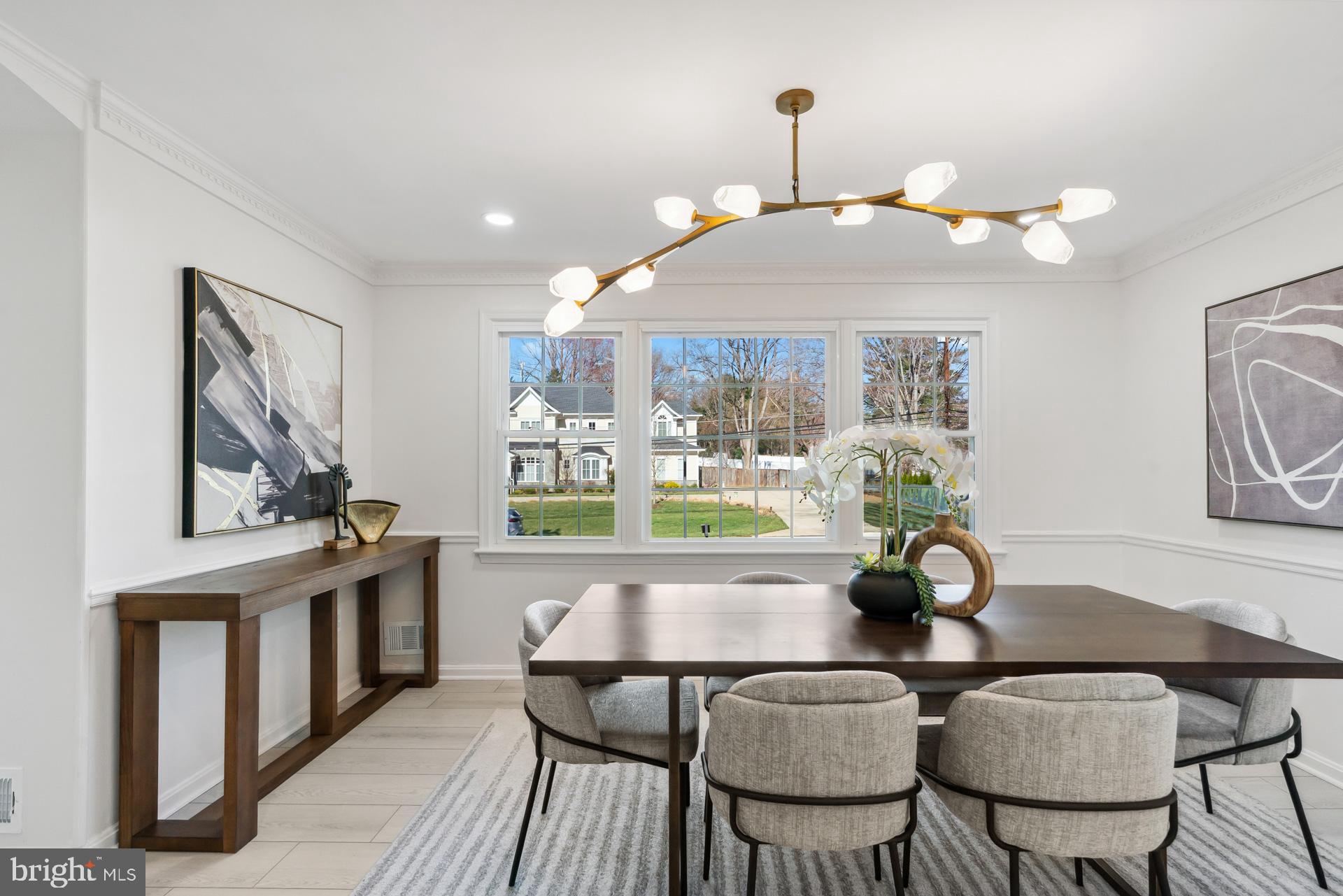 8417 Kingsgate Road Potomac, MD 20854 - Photo 13 of 61 a view of a dining room with furniture and a chandelier