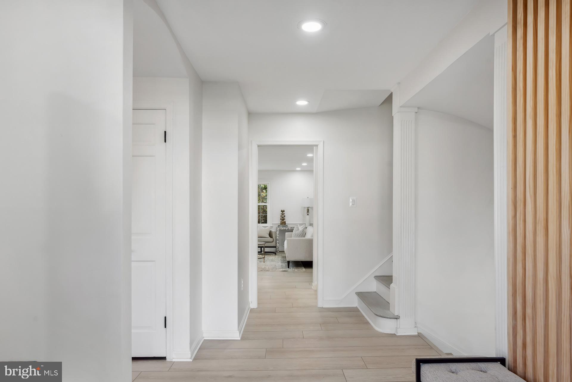 8417 Kingsgate Road Potomac, MD 20854 - Photo 20 of 61 a view of a hallway with bathroom and wooden floor