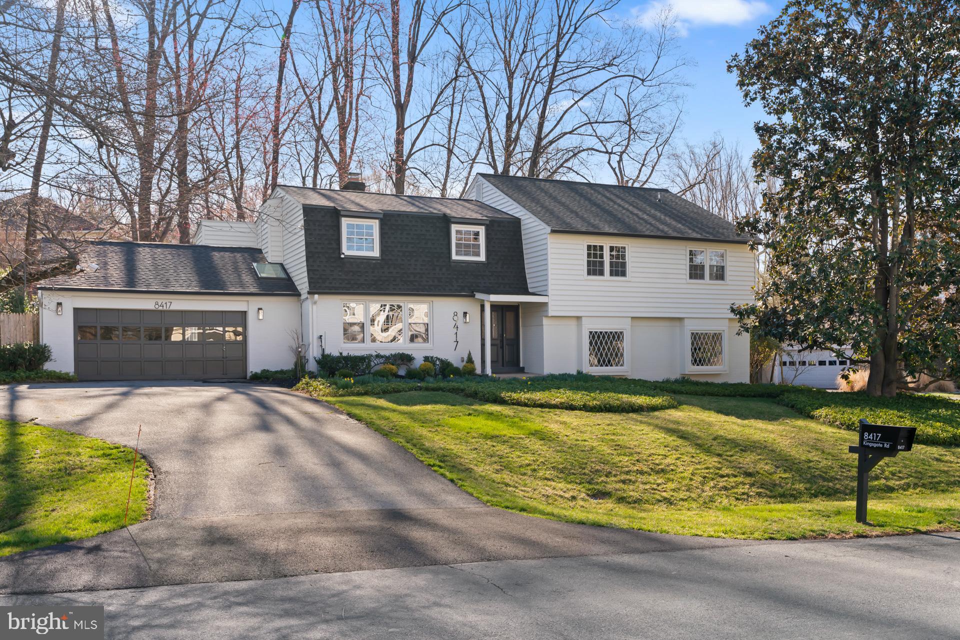 8417 Kingsgate Road Potomac, MD 20854 - Photo 2 of 61 a view of a house with a large pool and a yard