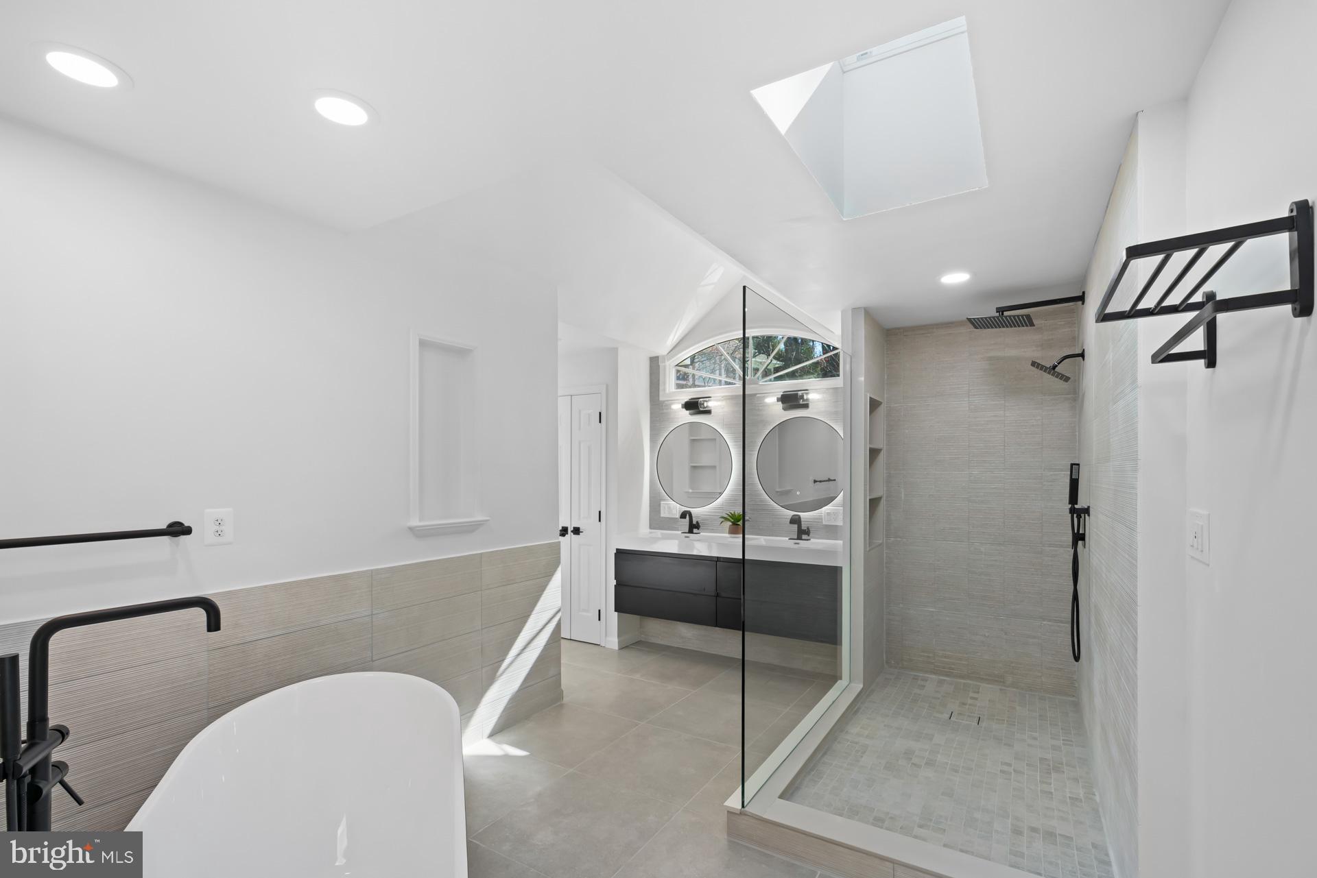 8417 Kingsgate Road Potomac, MD 20854 - Photo 43 of 61 a bathroom with a sink and a mirror