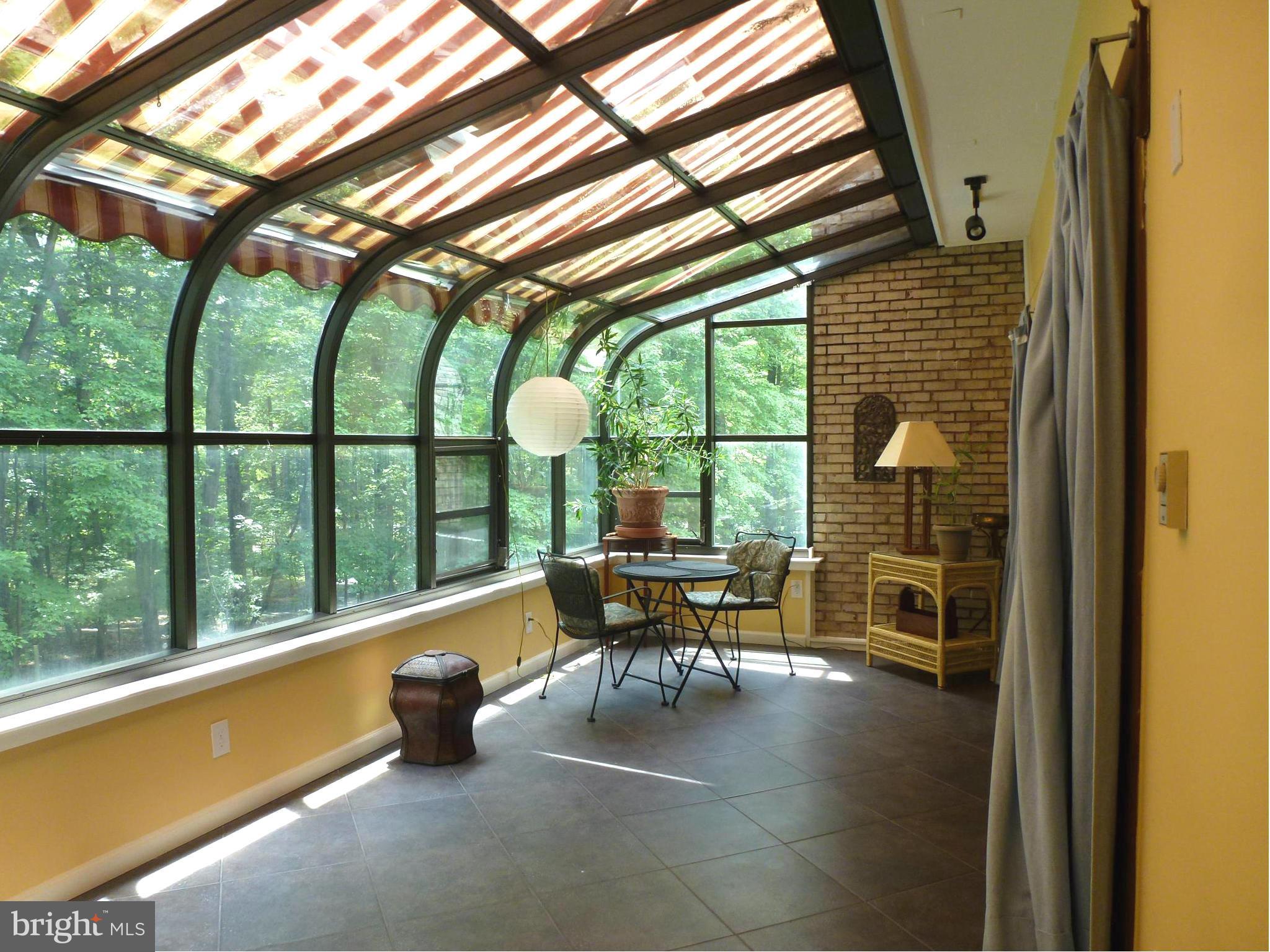 12132 Quorn Lane Reston, VA 20191 - Photo 11 of 30 Sun room has a movable awning.