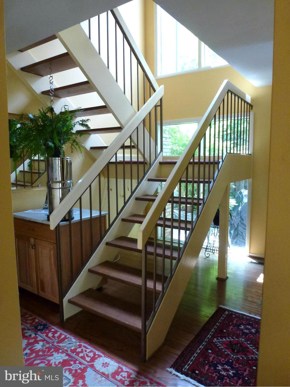 12132 Quorn Lane Reston, VA 20191 - Photo 16 of 30 Cathedral ceilings and huge windows in stairwell.