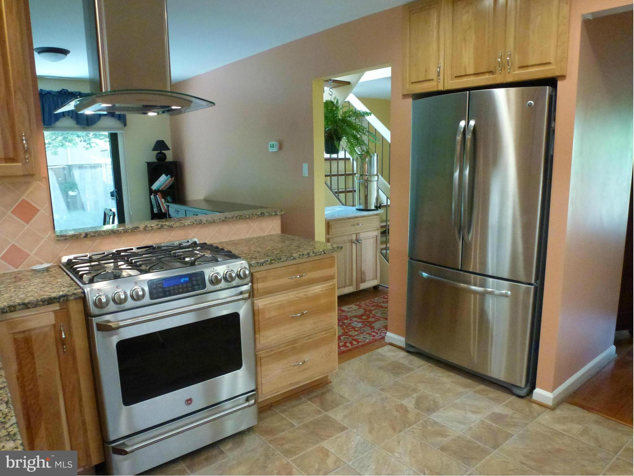 Kitchen features SS appliances.