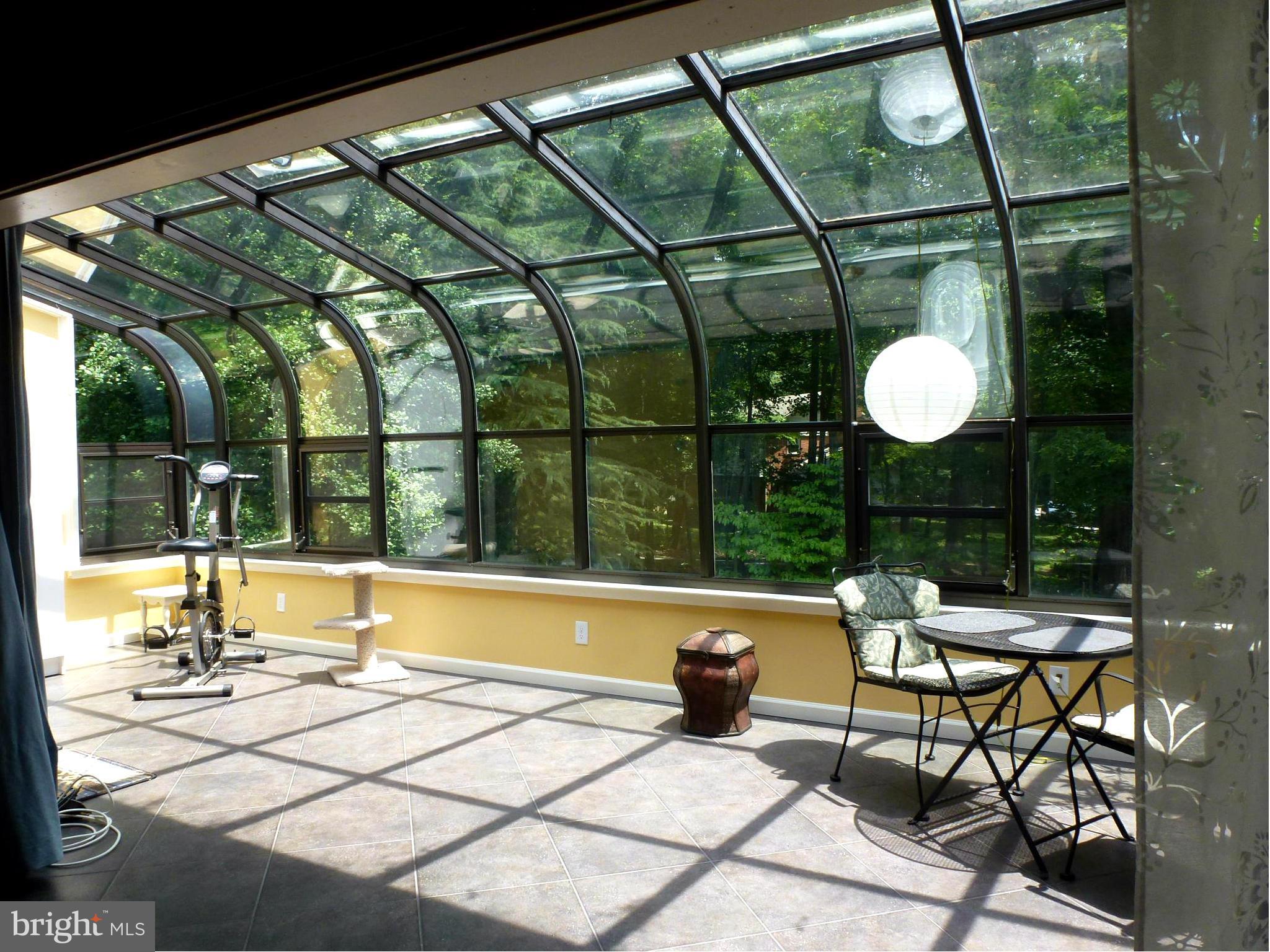 12132 Quorn Lane Reston, VA 20191 - Photo 9 of 30 Sun room is tiled with passive solar floor.