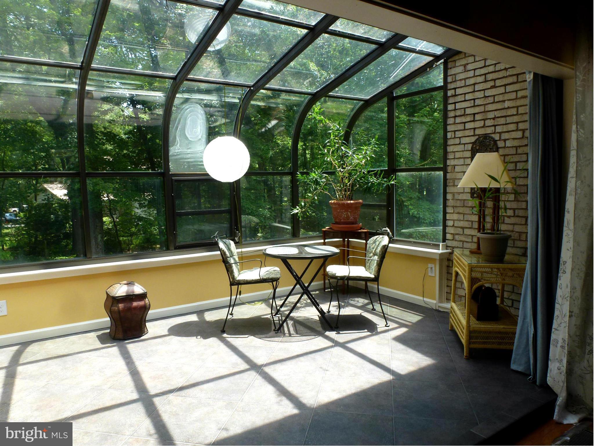12132 Quorn Lane Reston, VA 20191 - Photo 10 of 30 Sun room is tiled with passive solar floor.