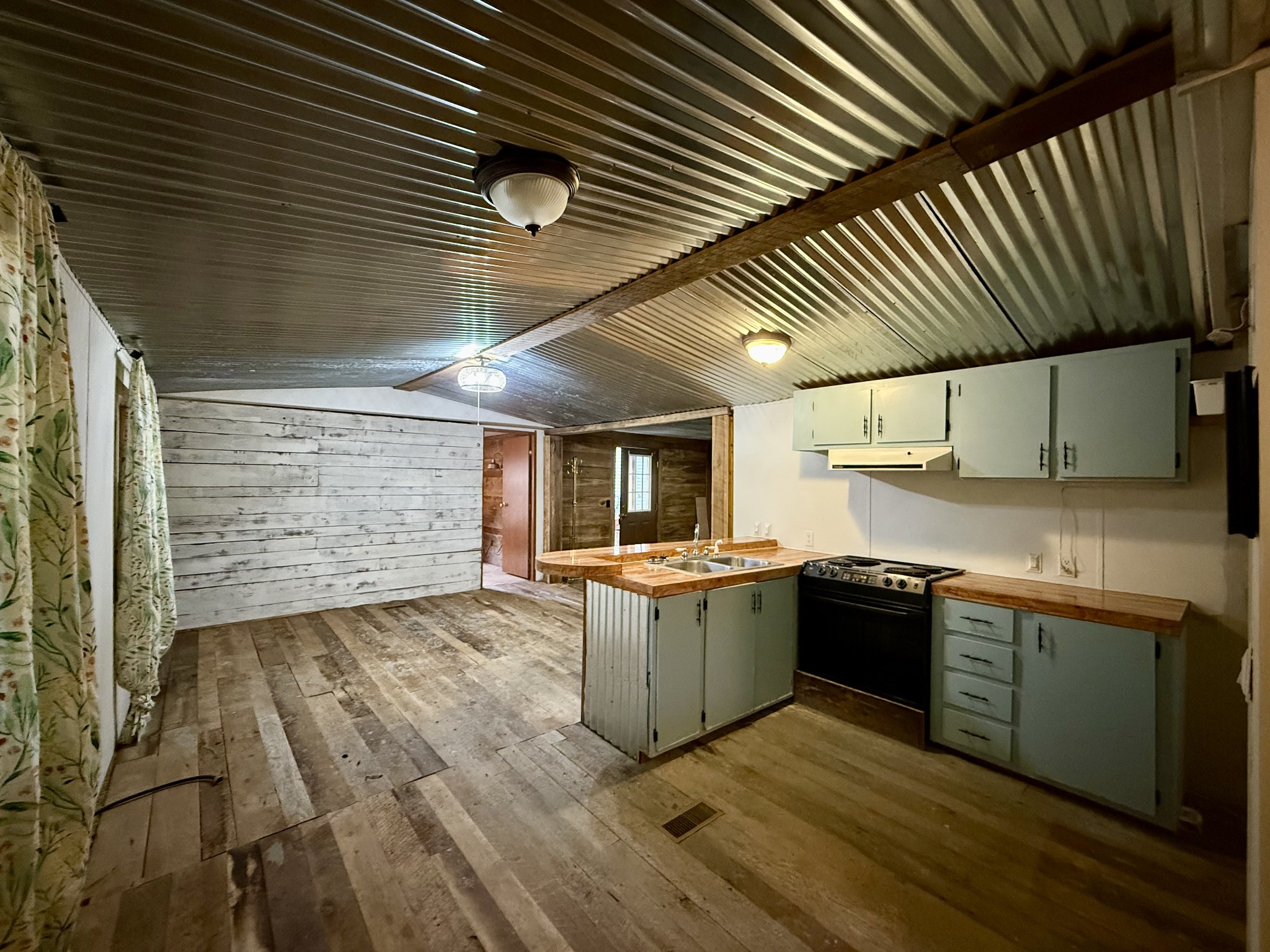 135 Haylee Road Waverly, TN 37185 - Photo 13 of 21 a kitchen with stainless steel appliances granite countertop a sink and stove