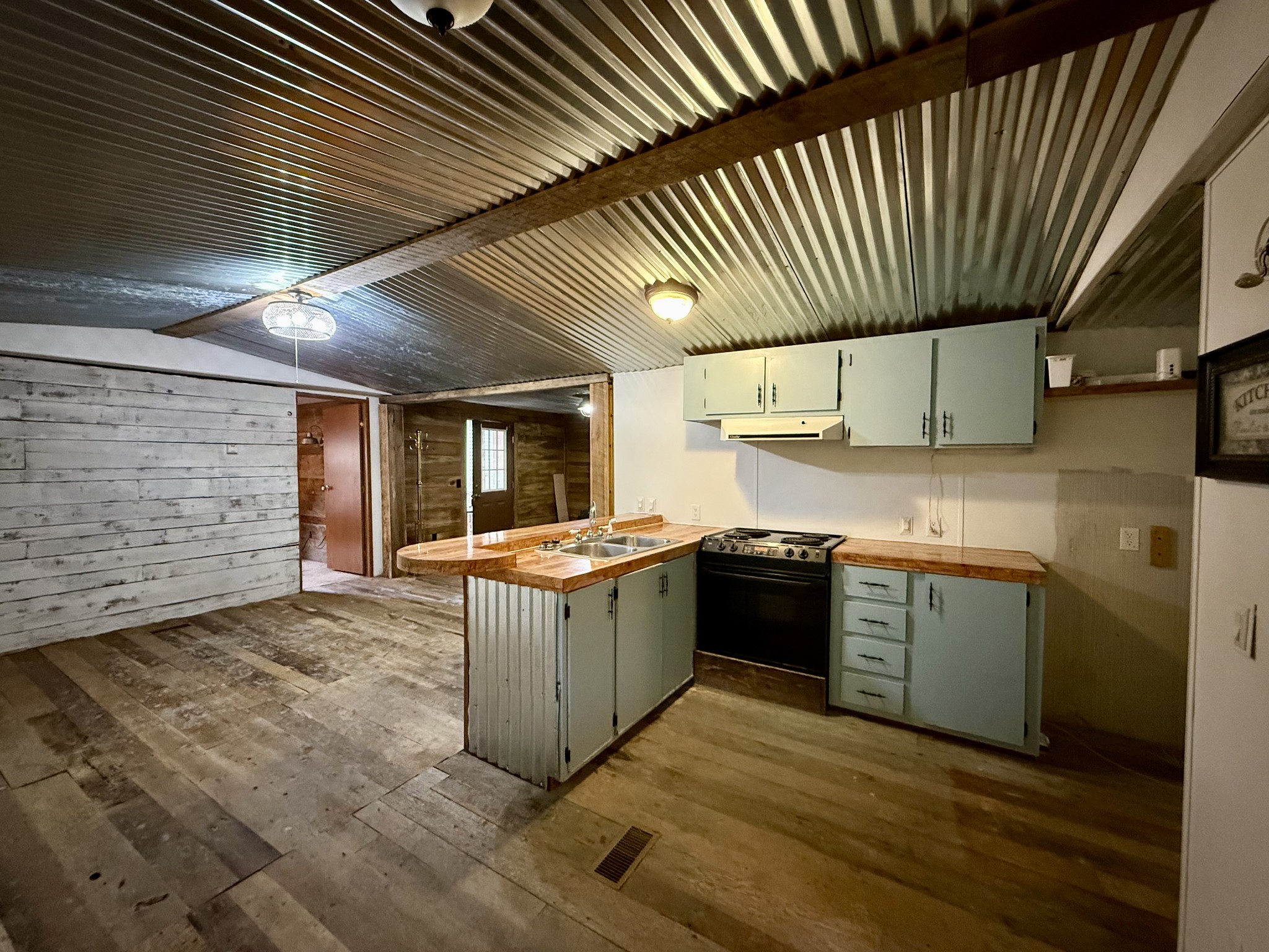 135 Haylee Road Waverly, TN 37185 - Photo 14 of 21 a kitchen with stainless steel appliances granite countertop a sink and cabinets