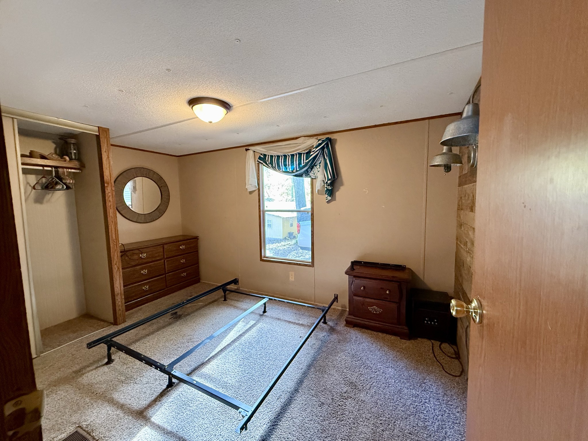 135 Haylee Road Waverly, TN 37185 - Photo 21 of 21 a living room with furniture a air conditioner vent and a window