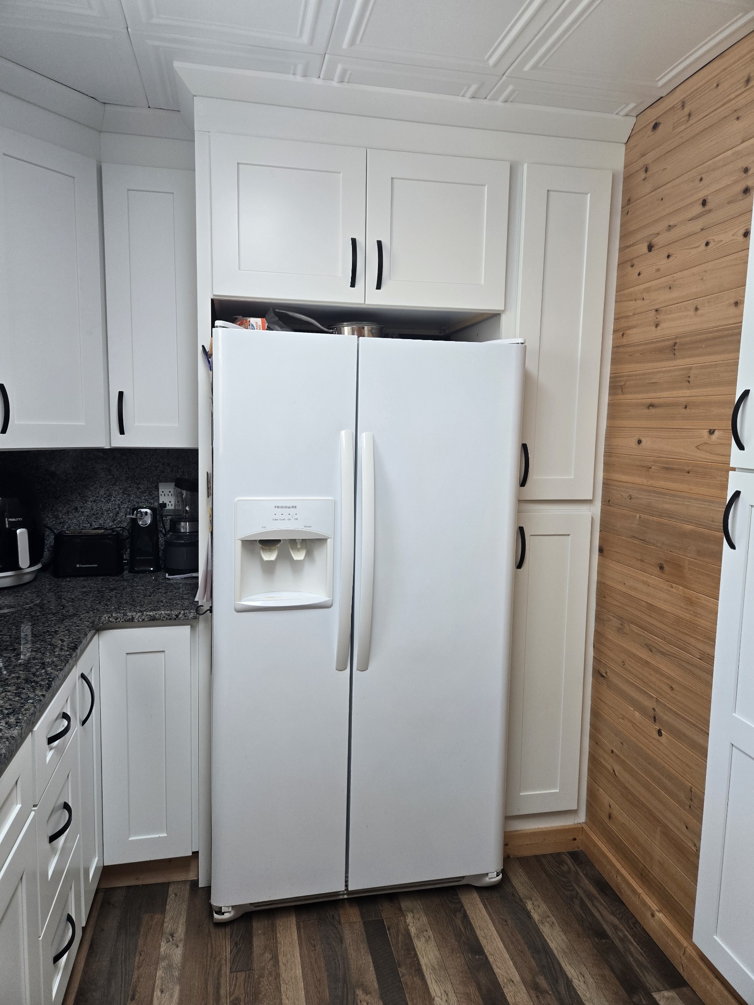 1605 New Dry Hollow Road Vanleer, TN 37181 - Photo 11 of 40 a white refrigerator freezer sitting in a kitchen